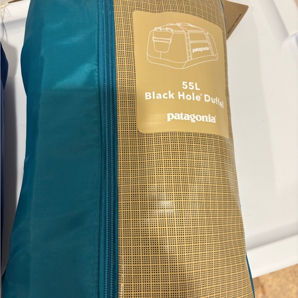 Patagonia Teal and Tan 55L Black Hole Duffel